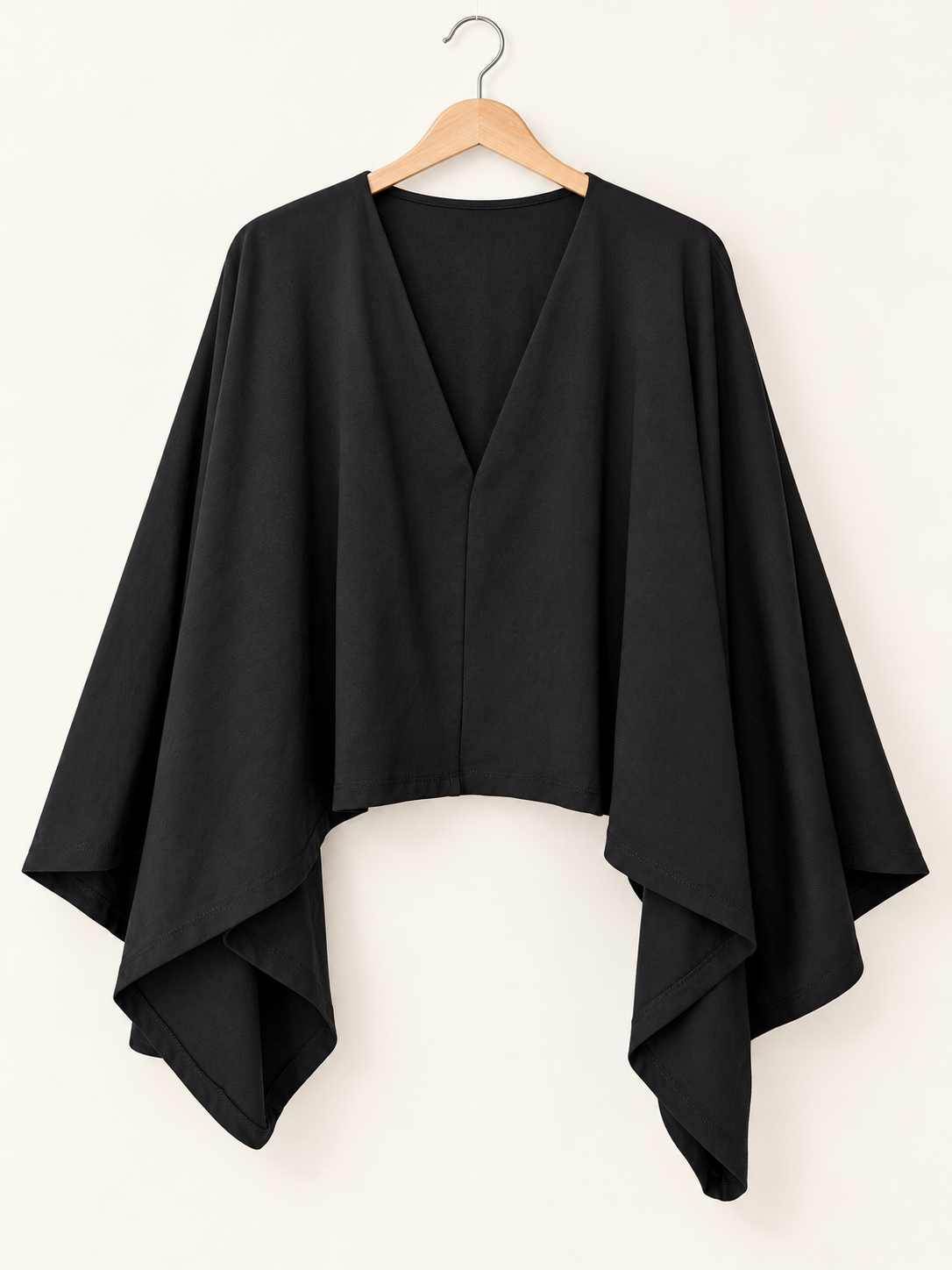 cape-style black blouse