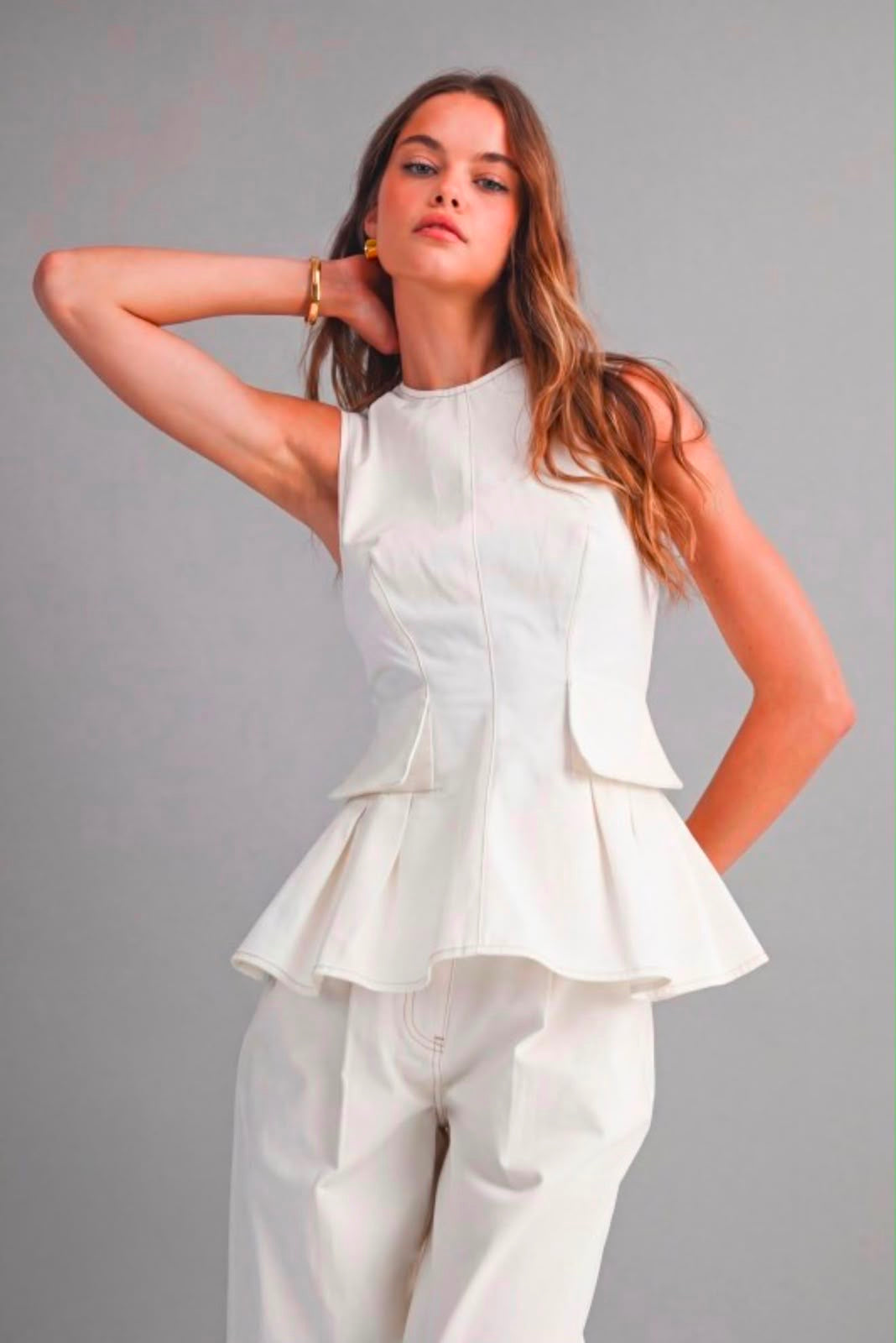Sleeveless structured peplum top