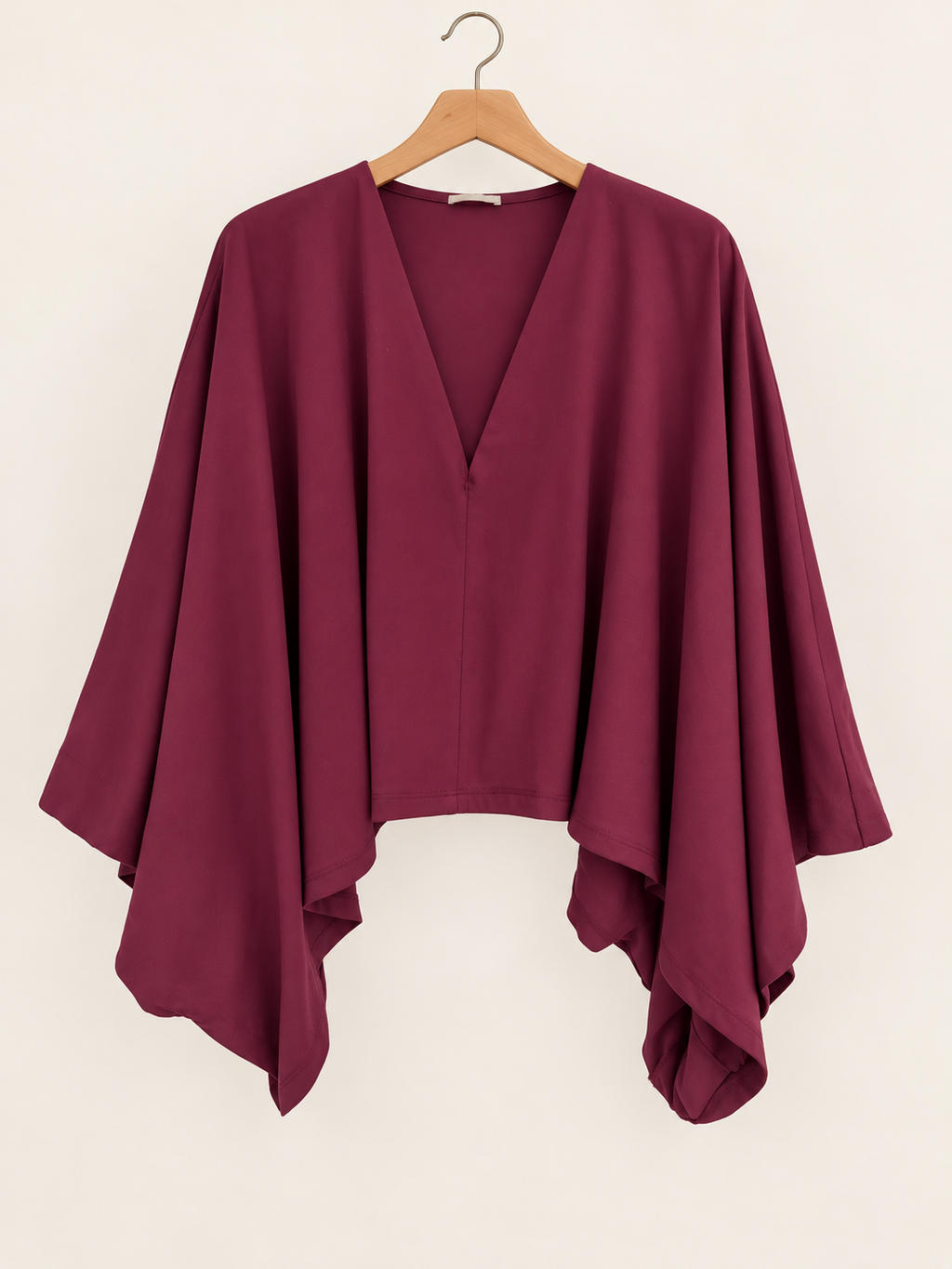 cape-style burgundy blouse