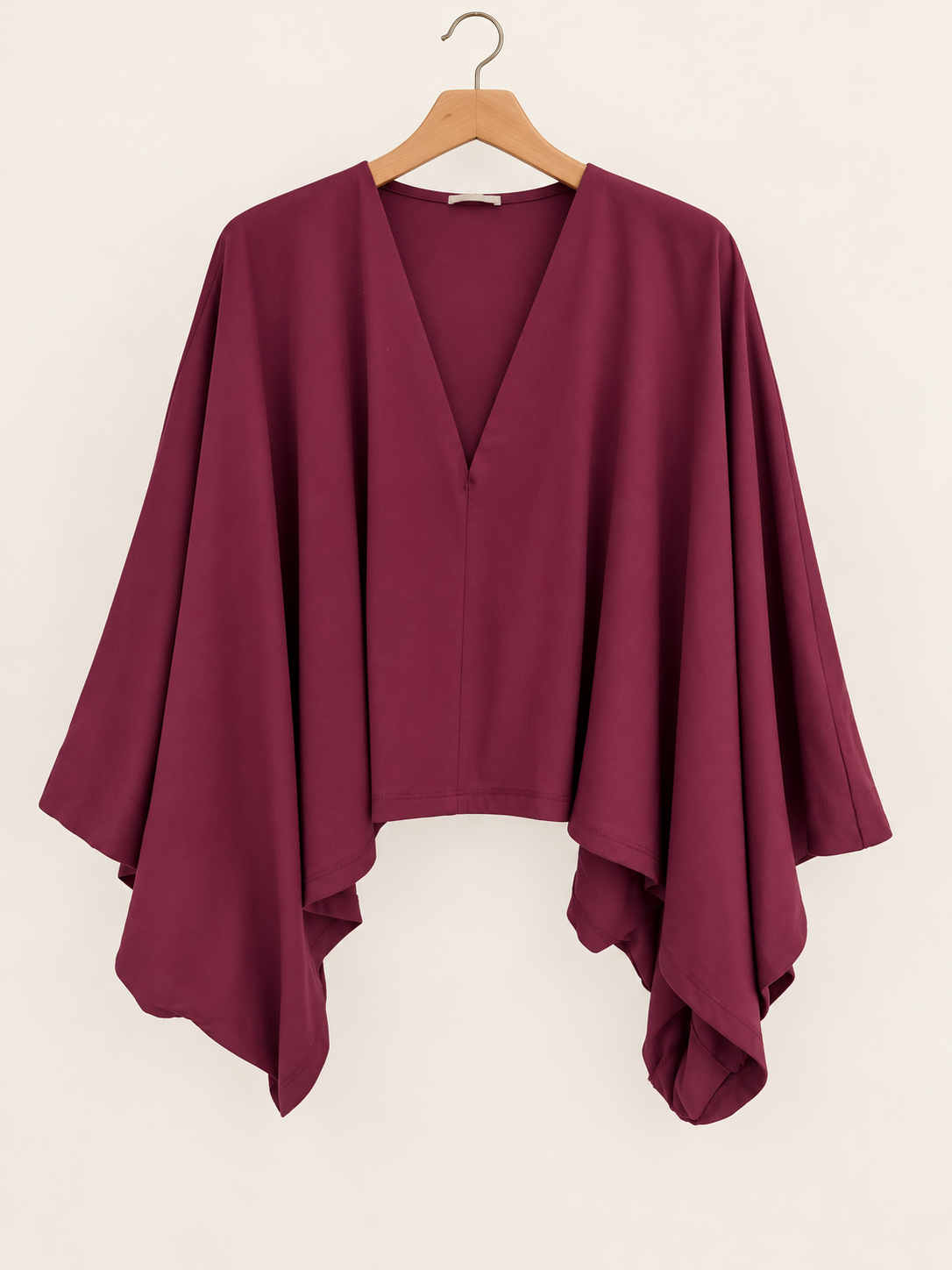 cape-style burgundy blouse