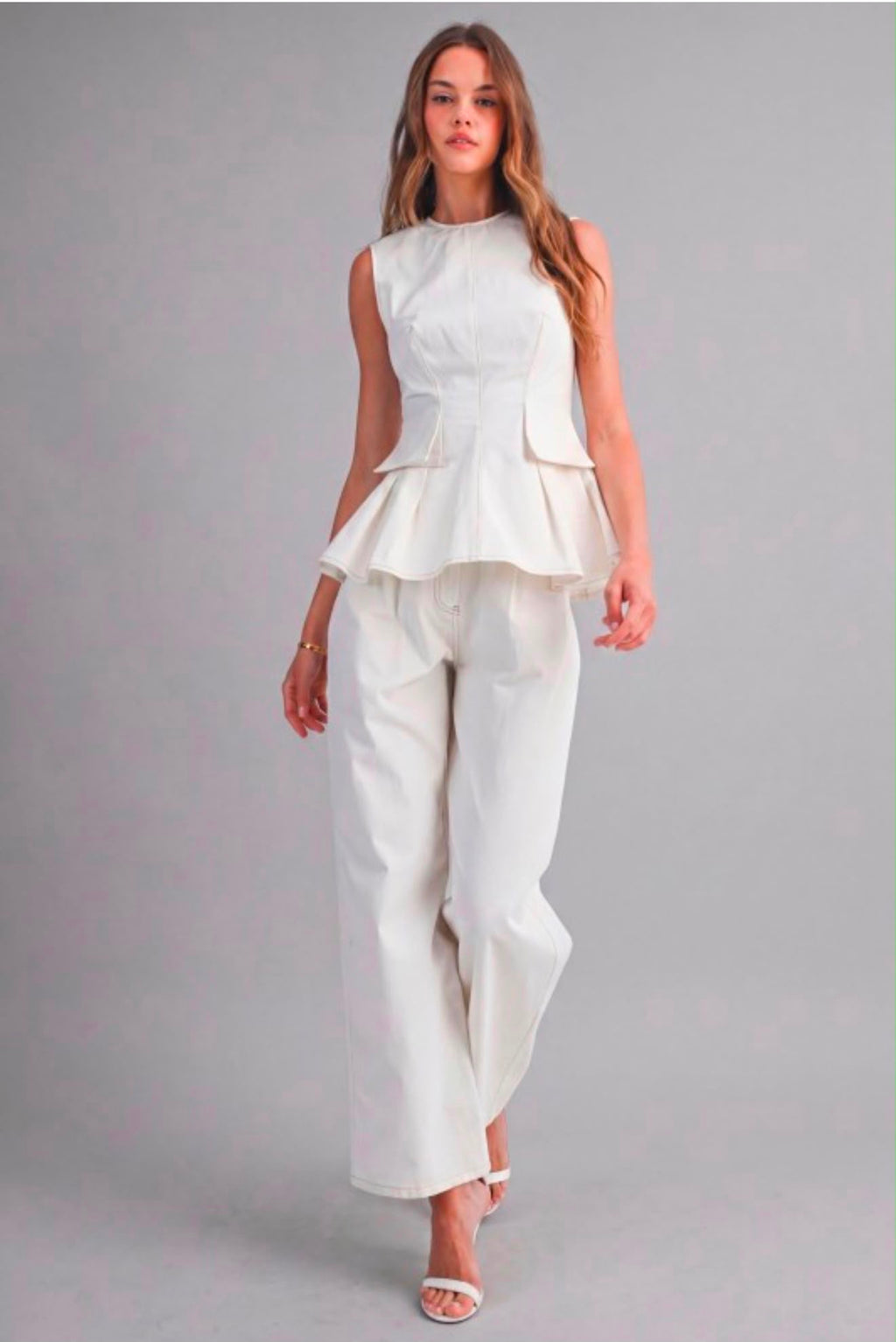 Sleeveless structured peplum top