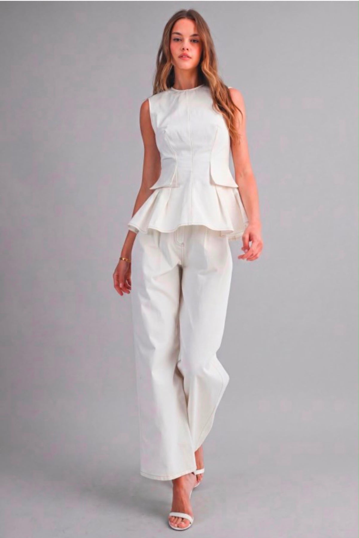 Sleeveless structured peplum top