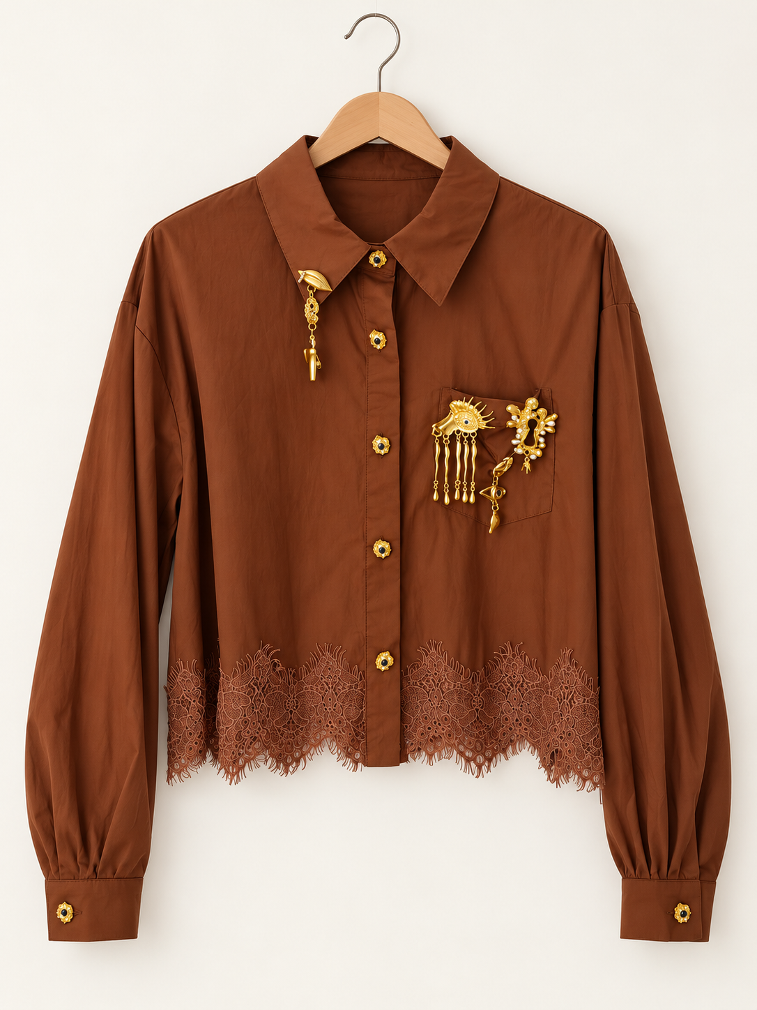 lace blouse with gold-tone pins