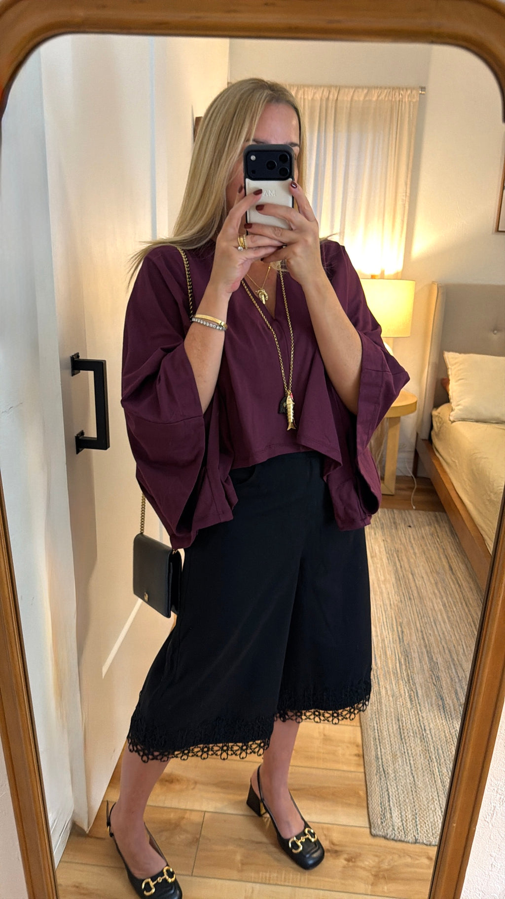 cape-style burgundy blouse