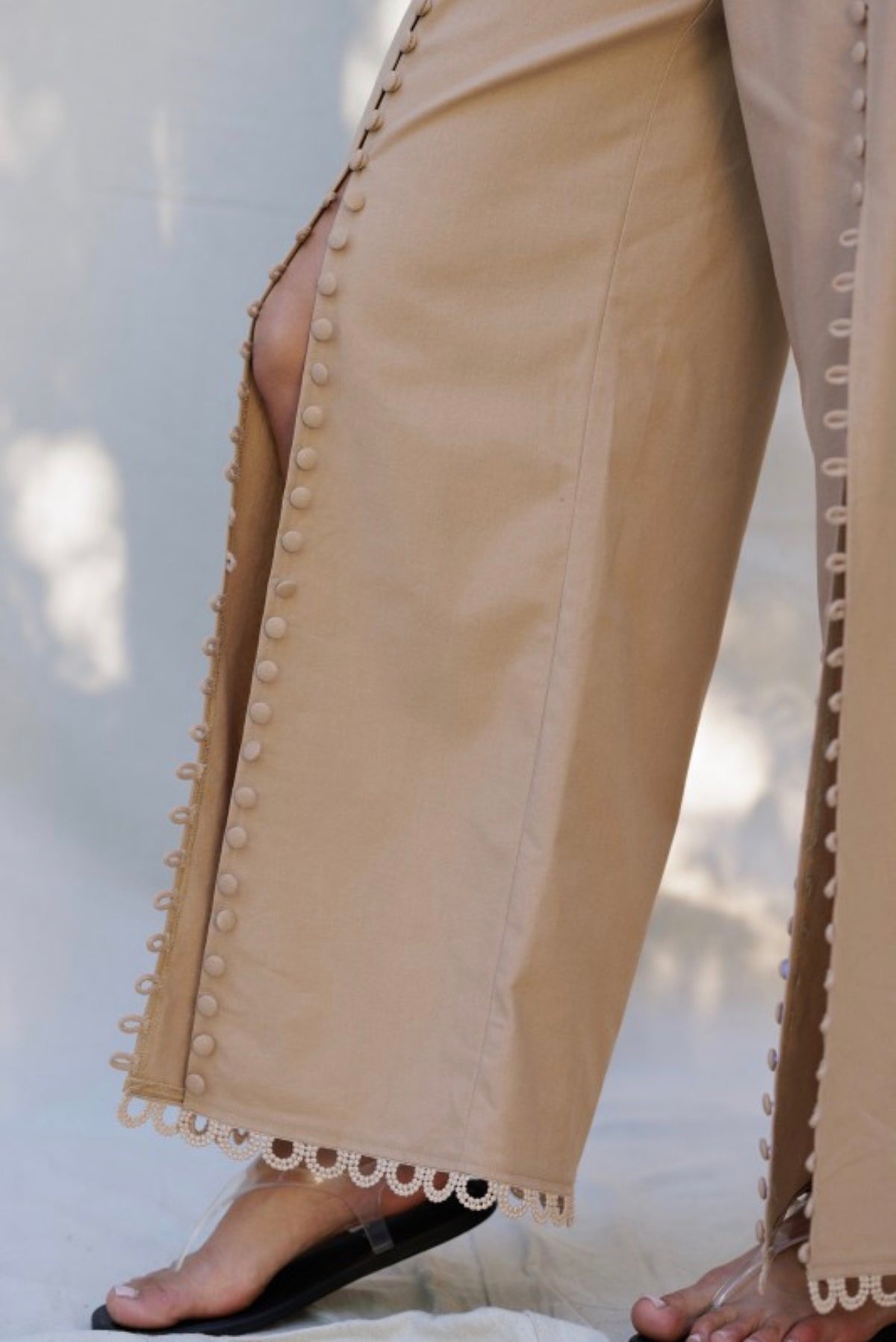EMBROIDERED HEM WIDE-LEG PANTS WITH
BUTTON DETAIL